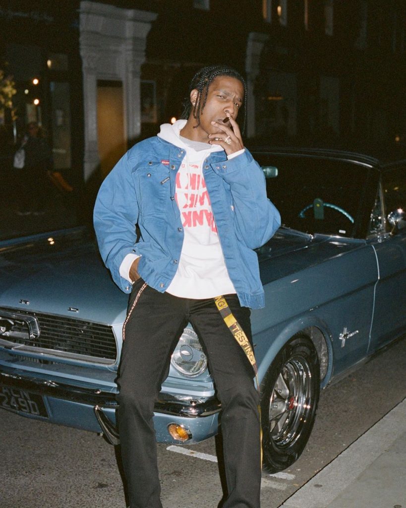ASAP Rocky with his Ferrai car and smoking