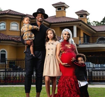 Cam newton with his kids and EX.  