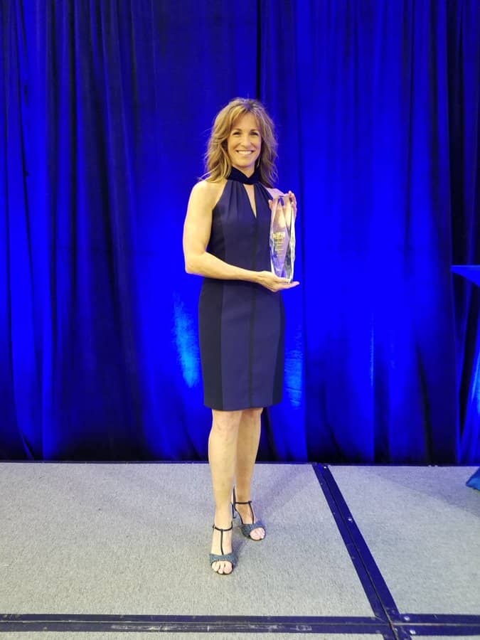 Suzy koblar receiving awards