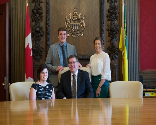 Scott Moe with his wife and children