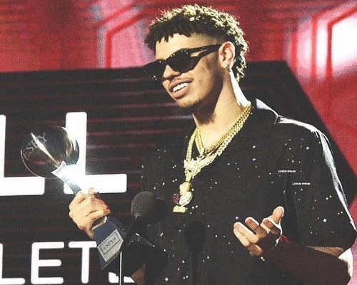 LaMelo Ball with his awards