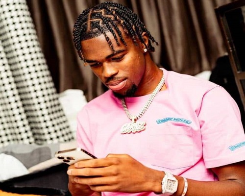 Carney Chukwuemeka with his iPhone