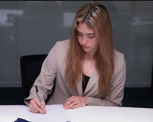 Korbin Albert is singing her contract